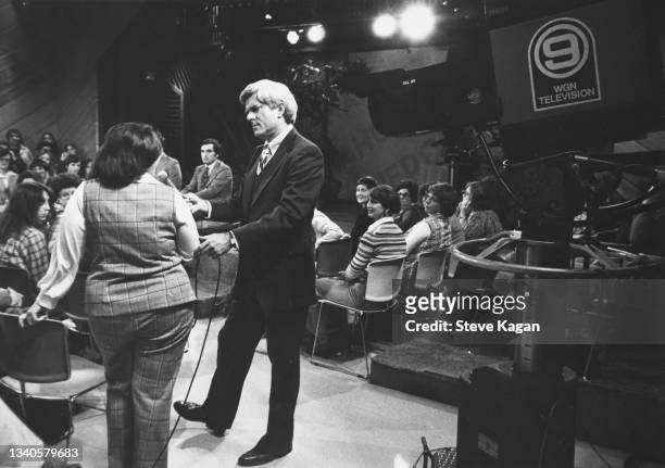 American talk show host and media personality Phil Donahue speaks to an unidentified audience member during an epside of his program, 'The Phil...