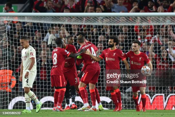 Mohamed Salah of Liverpool celebrates with teammates after scoring their side's second goal during the UEFA Champions League group B match between...
