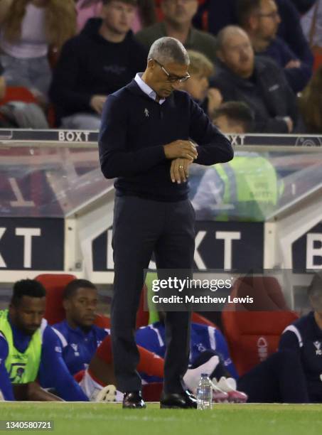 Nottingham Forest manager Chris Hughton checks his watch during the Sky Bet Championship match between Nottingham Forest and Middlesbrough at City...