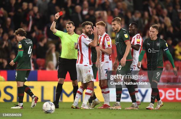 Stoke City player Tommy Smith reacts after being sent off by referee Leigh Doughty during the Sky Bet Championship match between Stoke City and...