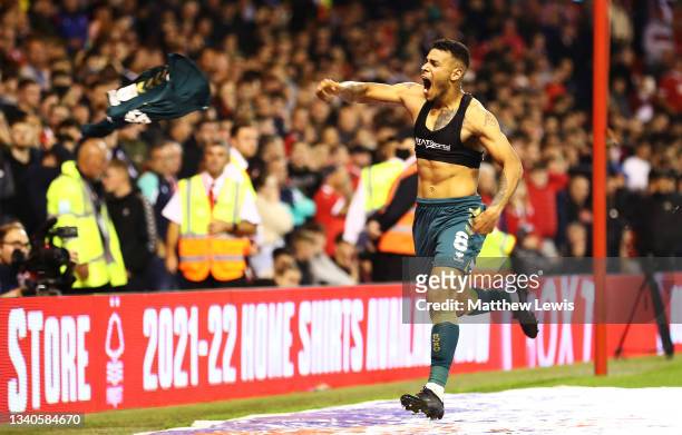 Onel Hernandez of Middlesbrough celebrates scoring his teams second goal by throwing his shirt into the crowd during the Sky Bet Championship match...
