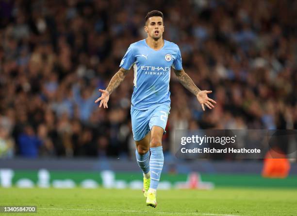 Joao Cancelo of Manchester City celebrates after scoring their side's fifth goal during the UEFA Champions League group A match between Manchester...