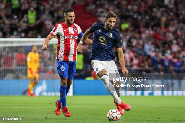 Koke Resurreccion of Atletico de Madrid and Marko Grujic of Porto in action during the UEFA Champions League first round group B football match...