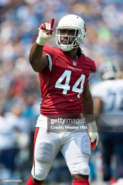 Markus Golden of the Arizona Cardinals signals after making a defensive play during the game against the Tennessee Titans at Nissan Stadium on...