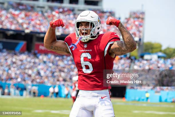 James Conner celebrates with DeAndre Hopkins of the Arizona Cardinals after a touchdown during the game against the Tennessee Titans at Nissan...