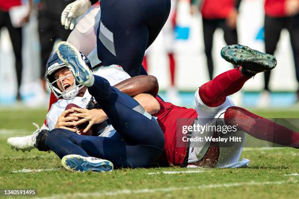 Ryan Tannehill of the Tennessee Titans is sacked by Chandler Jones of the Arizona Cardinals at Nissan Stadium on September 12, 2021 in Nashville,...