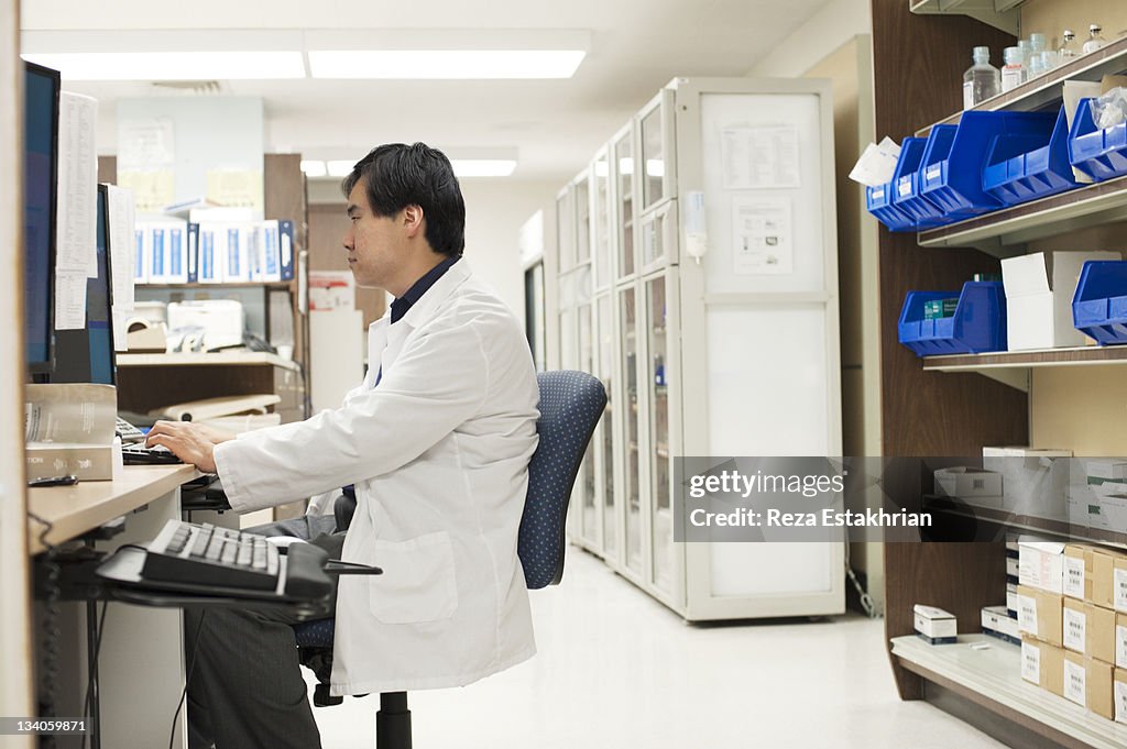 Doctor works at computer