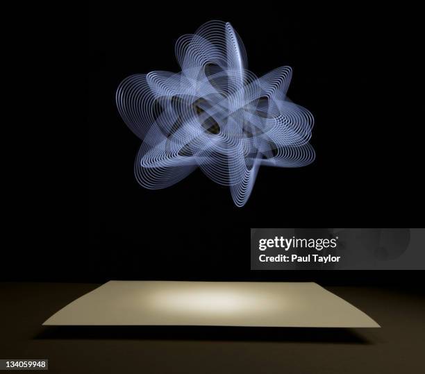 knot of light over paper - big idea stock-fotos und bilder