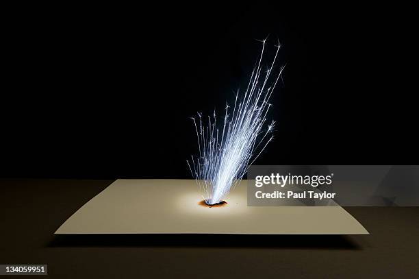 sparks shooting through paper - electric shock stock pictures, royalty-free photos & images
