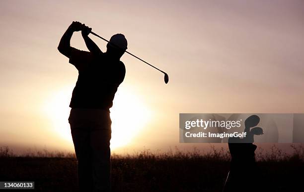 senior golfer silhouette - golfer walking stock pictures, royalty-free photos & images