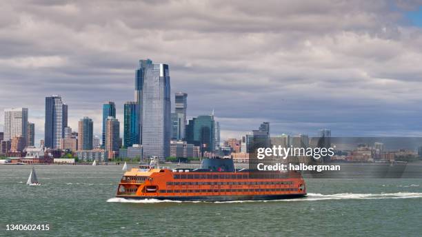 drone shot of staten island ferry passing downtown jersey city - staten island ferry bildbanksfoton och bilder