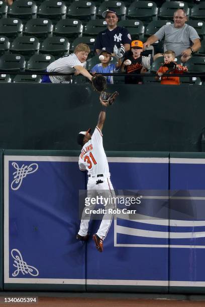 Cedric Mullins of the Baltimore Orioles catches a ball hit by Gary Sanchez of the New York Yankees for the third out of the second inning at Oriole...