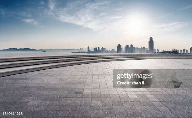 observation platform against urban skyline - floor perspective stock-fotos und bilder