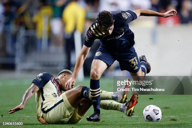 Roger Martínez of Club America and Leon Flach of Philadelphia Union battle for possession during the first half during the semifinal second leg match...