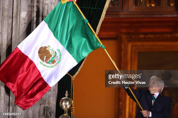 Andres Manuel Lopez Obrador, president of Mexico waves a mexican flag during the annual shout of independence as part of the independence day...
