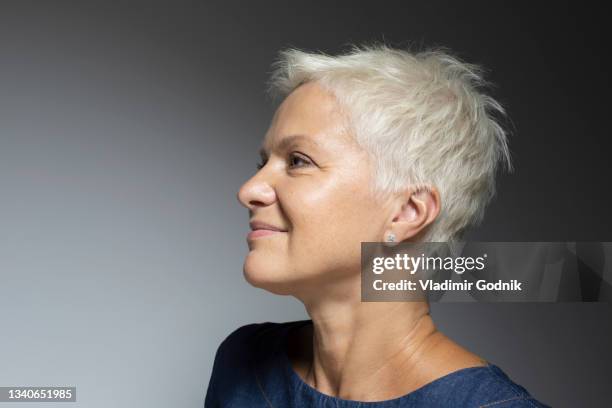 profile portrait beautiful mature woman with short white hair - man profile stock-fotos und bilder