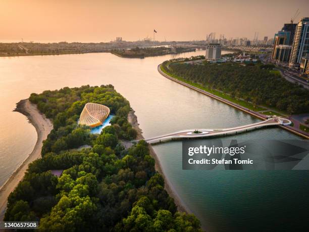 al noor island aerial view at sharjah emirate of the united arab emirates at sunset - dubai tourism stock pictures, royalty-free photos & images