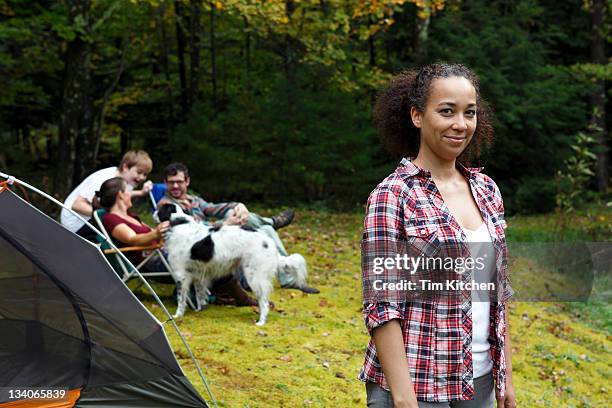 people on camping trip, woman in foreground - woodstock new york stockfoto's en -beelden