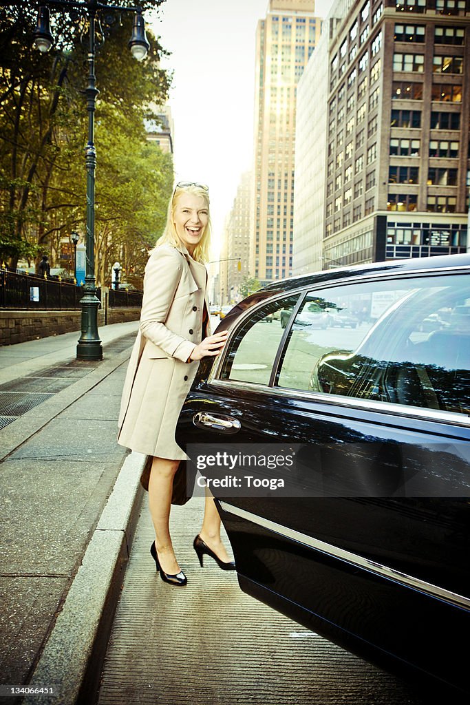 Woman getting into limousine in NYC