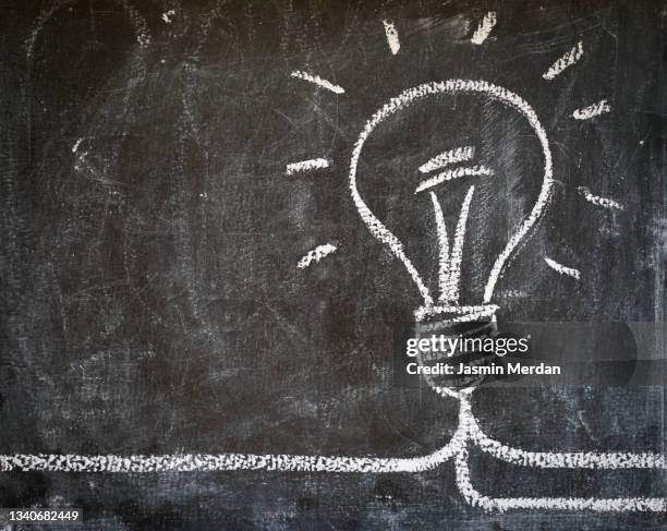 bulb means an idea! - idee stockfoto's en -beelden