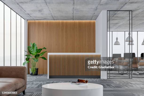 large office interior: a reception desk, a lounge corner with copy space and wordesks behind glass door - lobby stock pictures, royalty-free photos & images