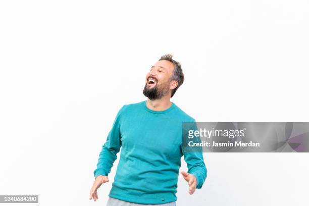 cool enjoying man laughing - three quarter length stock pictures, royalty-free photos & images