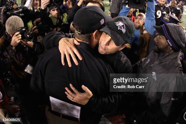 Head coach Jim Harbaugh of the San Francisco 49ers hugs his brother head coach John Harbaugh of the Baltimore Ravens after the Ravens defeated the...