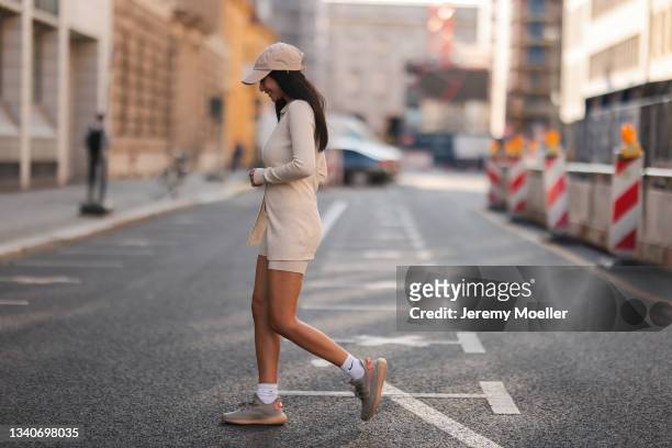 Paola Maria Koslowski wearing beige cap, beige two piece, yeezy sneaker on September 14, 2021 in Berlin, Germany.