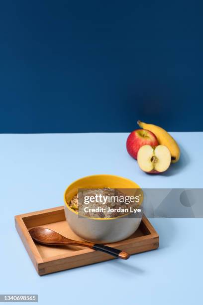 oatmeal for breakfast with banana and apple - oatmeal raisin stock pictures, royalty-free photos & images