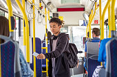 Boy paying fare through smart card in bus