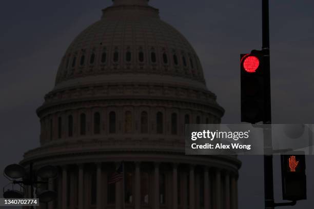 Traffic signal turns red as the U.S. Capitol is seen in the background on September 16, 2021 in Washington, DC. Security in the nation's Capital has...