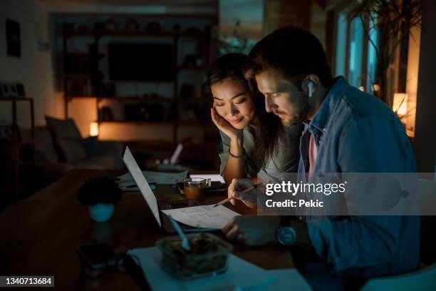 couple working late from home - asian wife stock pictures, royalty-free photos & images