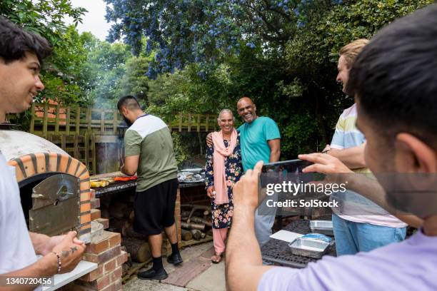 family making memories - asian person bbq stock pictures, royalty-free photos & images