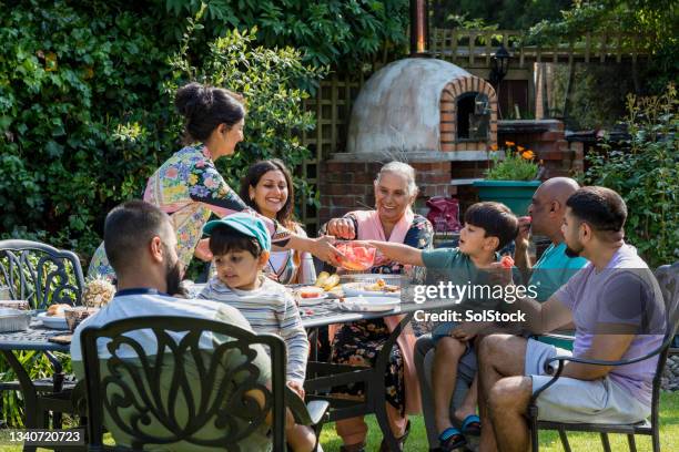 spending time as a family - male muslims uk stockfoto's en -beelden