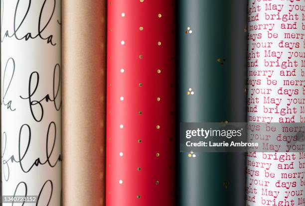 colorful holiday wrapping paper - roll of wrapping paper stock pictures, royalty-free photos & images