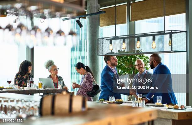 multi racial business colleagues at conference in hotel - colleague lunch stock pictures, royalty-free photos & images