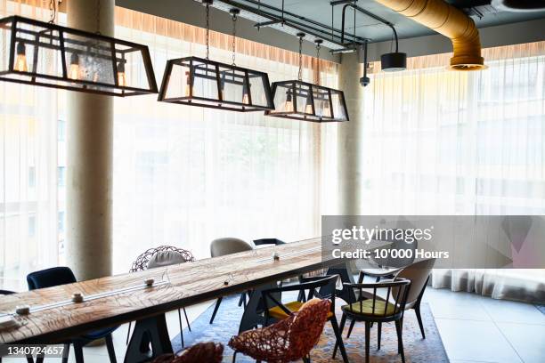 stylish meeting table in modern event centre - long table stock pictures, royalty-free photos & images