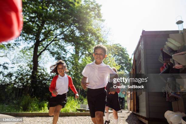 racing each other - school uniform stock pictures, royalty-free photos & images