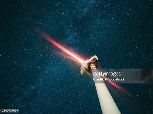 a wind turbine under the stars at night - long exposure stars stock pictures, royalty-free photos & images