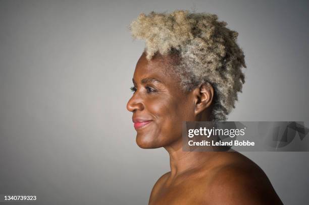 studio portrait of middle aged african american woman - beautiful older black women stock pictures, royalty-free photos & images