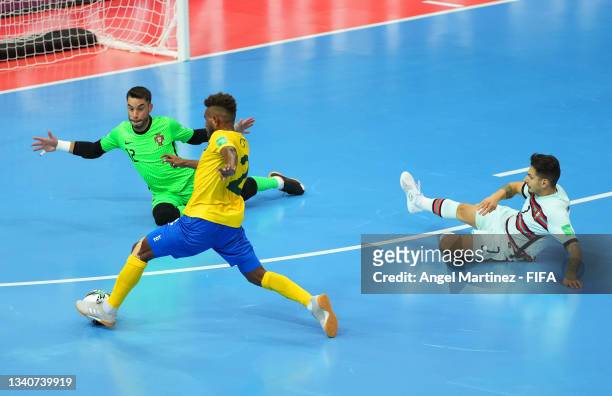 Alvin Hou of Solomon Islands shoots as Andre Sousa of Portugal attempts to save during the FIFA Futsal World Cup 2021 group C match between Solomon...