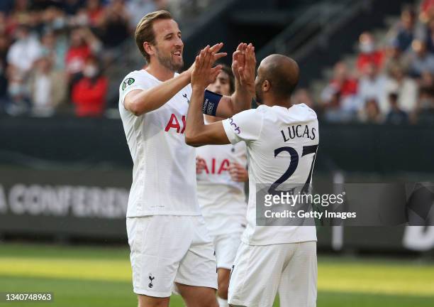 Harry Kane and Lucas Moura of Tottenham Hotspur celebrate their side's first goal, an own goal by Loic Bade of Rennes during the UEFA Europa...