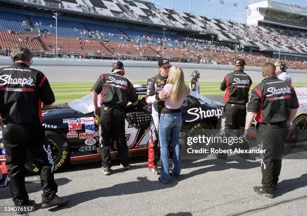 Driver Kurt Busch talks to his girlfriend Eva Bryan prior to making his 2005 Daytona 500 qualifying run at the Daytona International Speedway on...