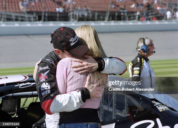 Driver Kurt Busch hugs his girlfriend Eva Bryan prior to making his 2005 Daytona 500 qualifying run at the Daytona International Speedway on February...