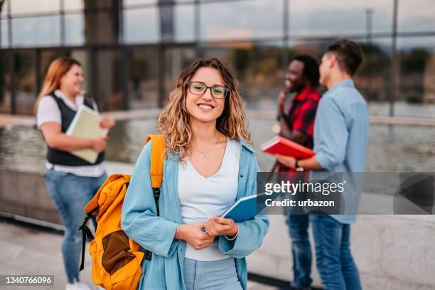beautiful smiling female college student - adult student stock pictures, royalty-free photos & images