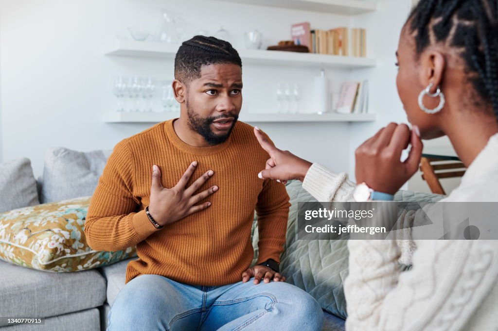 Shot of a young couple having an argument at home