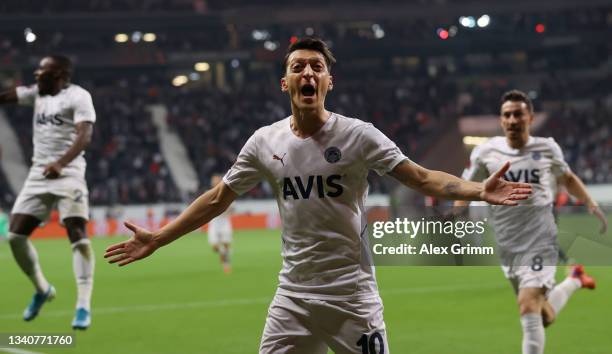 Mesut Ozil of Fenerbahce celebrates after scoring their side's first goal during the UEFA Europa League group D match between Eintracht Frankfurt and...