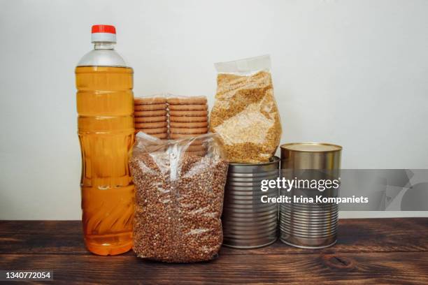 food products stands on kitchen wooden table. - buckwheat isolated stock pictures, royalty-free photos & images