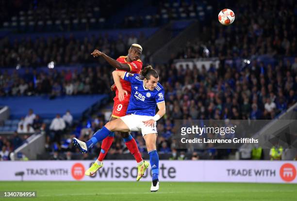Victor Osimhen of SSC Napoli scores their side's second goal whilst under pressure from Caglar Soyuncu of Leicester City during the UEFA Europa...