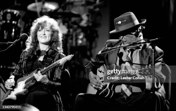 American blues singer, guitarist, songwriter, and activist Bonnie Raitt and American blues singer, songwriter, and guitarist John Lee Hooker sing and...